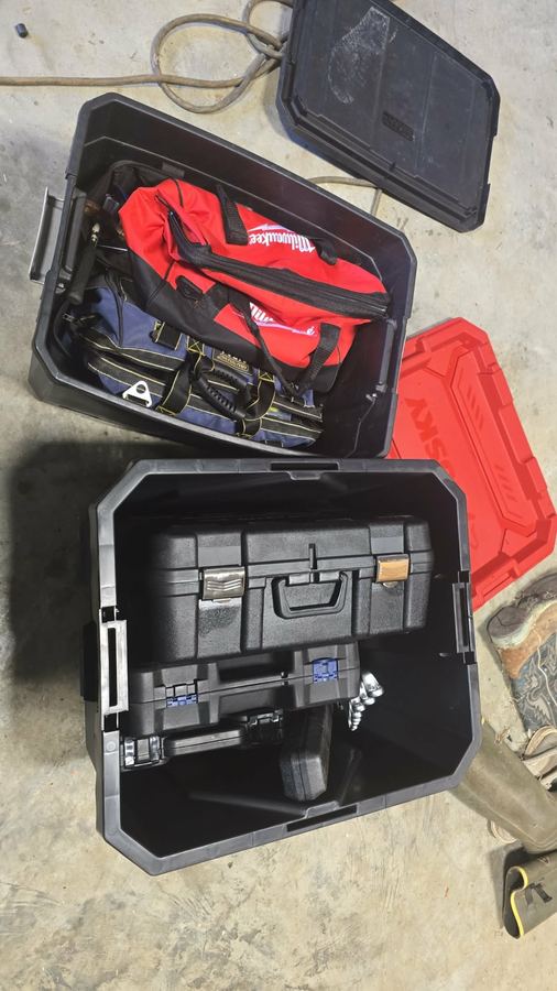 Tool cases and bags loaded for a mobile repair call